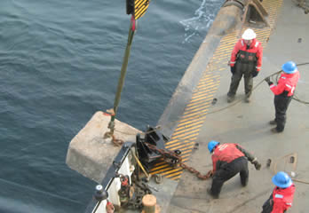 Lowering concrete buoy sinkers