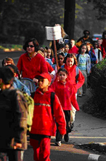 Adults walk wih children in Maplewood